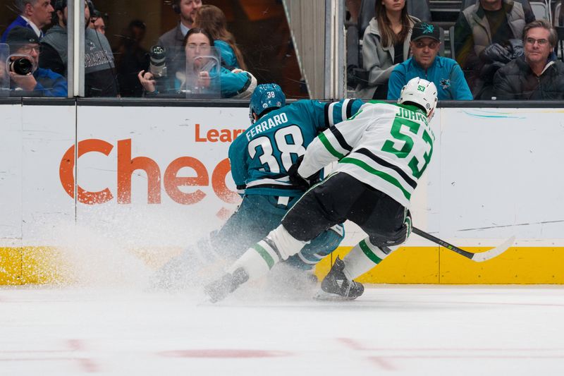 Jan 18, 2023; San Jose, California, USA;  San Jose Sharks defenseman Mario Ferraro (38) and Dallas Stars center Wyatt Johnston (53) battle for the puck against the boards during the third period at SAP Center at San Jose. Mandatory Credit: Neville E. Guard-USA TODAY Sports