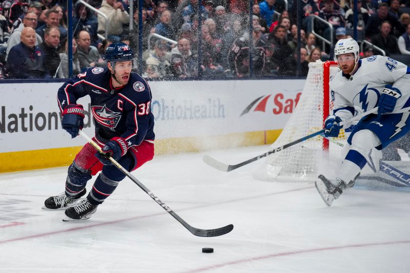 Nov 2, 2023; Columbus, Ohio, USA;  Columbus Blue Jackets center Boone Jenner (38) skates with the puck against the Tampa Bay Lightning in the third period at Nationwide Arena. Mandatory Credit: Aaron Doster-USA TODAY Sports