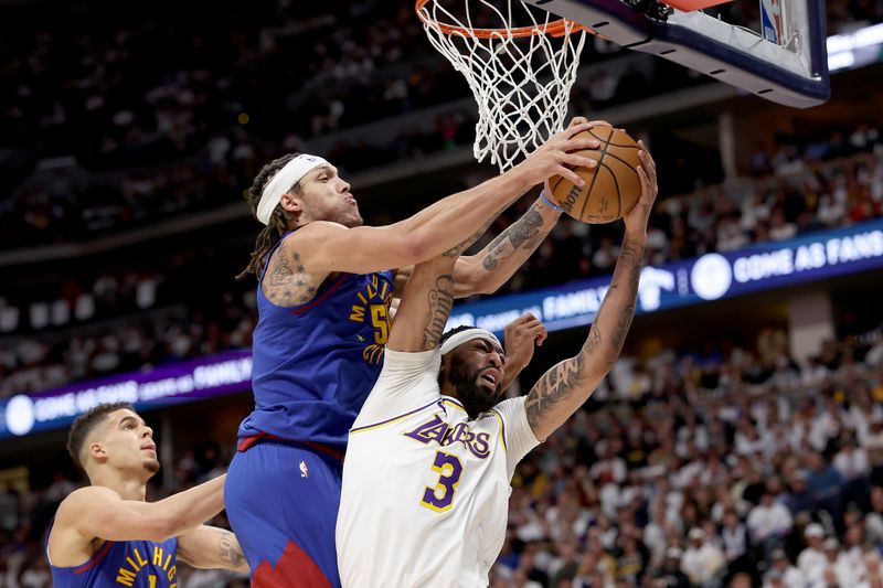 DENVER, COLORADO - APRIL 20: Aaron Gordon #50 of the Denver Nuggets fights for a rebound against Anthony Davis #3 of the Los Angeles Lakers in the first quarter during game one of the Western Conference First Round Playoffs at Ball Arena on April 20, 2024 in Denver, Colorado.  NOTE TO USER: User expressly acknowledges and agrees that, by downloading and or using this photograph, User is consenting to the terms and conditions of the Getty Images License Agreement. (Photo by Matthew Stockman/Getty Images)