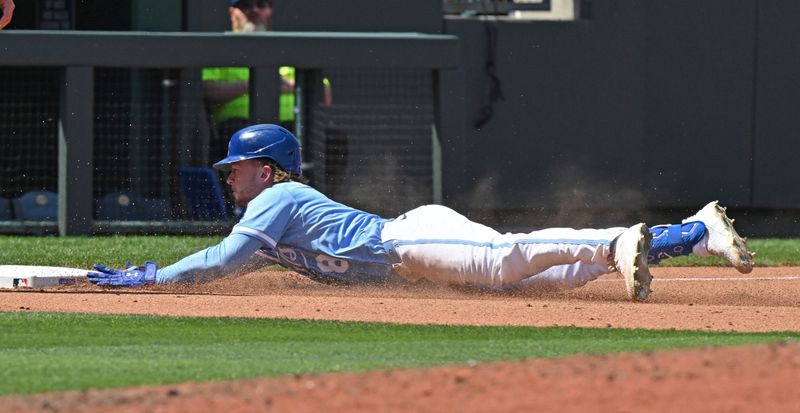 May 18, 2025; Kansas City, Missouri, USA;  Kansas City Royals pinch hitter Drew Waters (8) dives into third base for a triple in the seventh inning against the St. Louis Cardinals at Kauffman Stadium. Mandatory Credit: Peter Aiken-Imagn Images