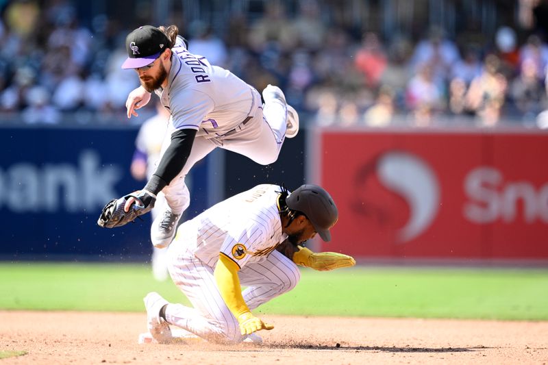 Sep 20, 2023; San Diego, California, USA; Colorado Rockies second baseman Brendan Rodgers (7) forces out San Diego Padres third baseman Eguy Rosario (5) at second base during the sixth inning at Petco Park. Mandatory Credit: Orlando Ramirez-USA TODAY Sports