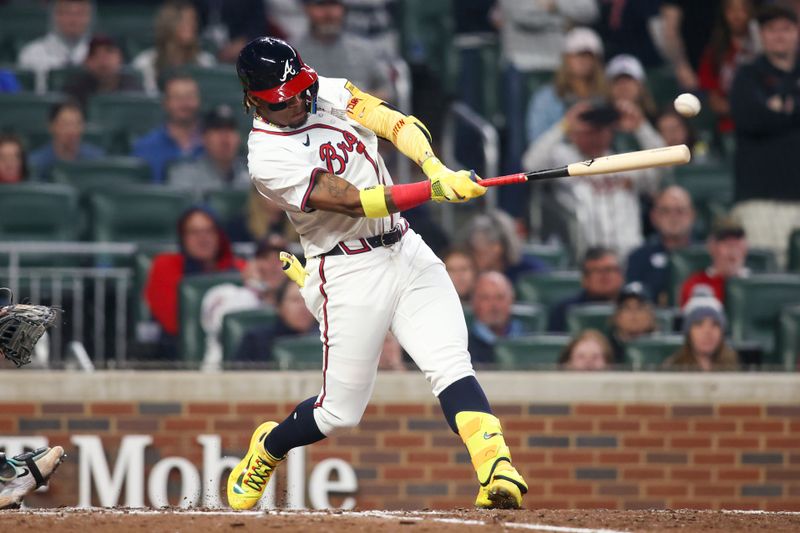 Apr 6, 2024; Atlanta, Georgia, USA; Atlanta Braves right fielder Ronald Acuna Jr. (13) hits a RBI single against the Arizona Diamondbacks in the eighth inning at Truist Park. Mandatory Credit: Brett Davis-USA TODAY Sports