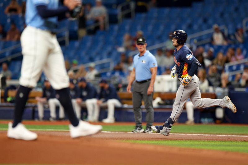 Aug 12, 2024; St. Petersburg, Florida, USA; Houston Astros third baseman Alex Bregman (2) rounds the bases after hitting a home run against the Tampa Bay Rays in the first inning  at Tropicana Field. Mandatory Credit: Nathan Ray Seebeck-USA TODAY Sports