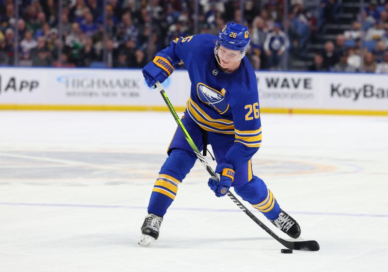 Feb 21, 2023; Buffalo, New York, USA;  Buffalo Sabres defenseman Rasmus Dahlin (26) takes a shot on goal during the second period against the Toronto Maple Leafs at KeyBank Center. Mandatory Credit: Timothy T. Ludwig-USA TODAY Sports