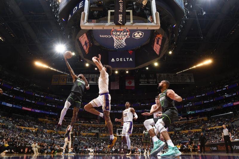 LOS ANGELES, CA - APRIL 7: Nickeil Alexander-Walker #9 of the Minnesota Timberwolves drives to the basket during the game against the Los Angeles Lakers on April 7, 2024 at Crypto.Com Arena in Los Angeles, California. NOTE TO USER: User expressly acknowledges and agrees that, by downloading and/or using this Photograph, user is consenting to the terms and conditions of the Getty Images License Agreement. Mandatory Copyright Notice: Copyright 2024 NBAE (Photo by Juan Ocampo/NBAE via Getty Images)