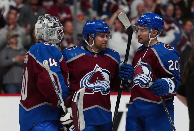 Apr 28, 2024; Denver, Colorado, USA; Colorado Avalanche goaltender Alexandar Georgiev (40) and forward Nikolai Kovalenko (51) and center Ross Colton (20) celebrate the win over the Winnipeg Jets following game four of the first round of the 2024 Stanley Cup Playoffs at Ball Arena. Mandatory Credit: Ron Chenoy-USA TODAY Sports