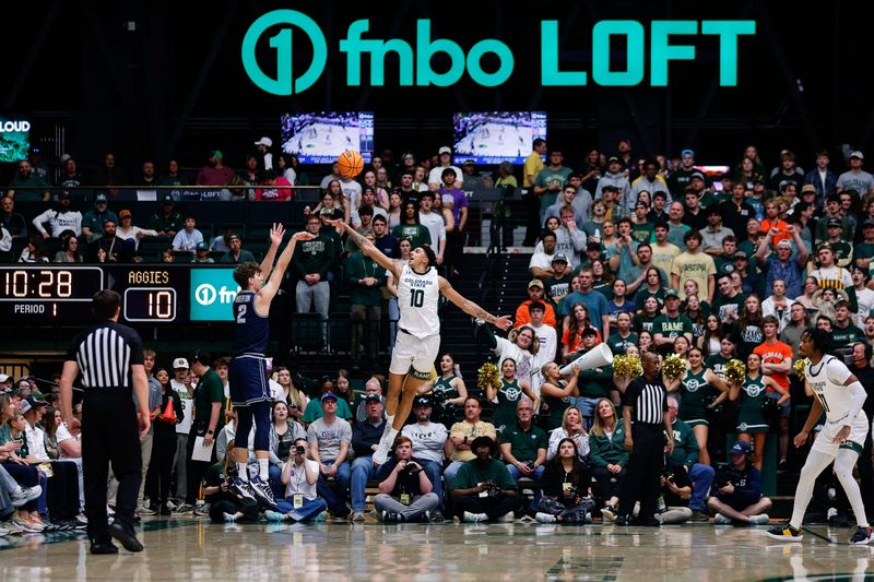 Mar 1, 2025; Fort Collins, Colorado, USA; Utah State Aggies forward Tucker Anderson (2) attempts a shot as Colorado State Rams guard Nique Clifford (10) defends in the first half at Moby Arena. Mandatory Credit: Isaiah J. Downing-Imagn Images