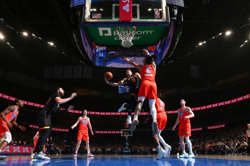 OKLAHOMA CITY, OK - MARCH 29: Grayson Allen #8 of the Phoenix Suns drives to the basket during the game against the Oklahoma City Thunder on March 29, 2024 at Paycom Arena in Oklahoma City, Oklahoma. NOTE TO USER: User expressly acknowledges and agrees that, by downloading and or using this photograph, User is consenting to the terms and conditions of the Getty Images License Agreement. Mandatory Copyright Notice: Copyright 2024 NBAE (Photo by Zach Beeker/NBAE via Getty Images)