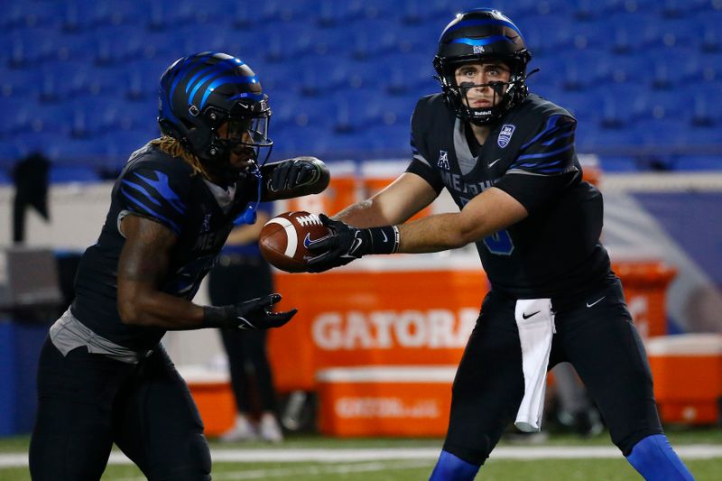 Nov 10, 2022; Memphis, Tennessee, USA; Memphis Tigers quarterback Seth Henigan (5) hands the ball off to running back Brandon Thomas (left) during warm ups prior to the game against the Tulsa Golden Hurricane at Liberty Bowl Memorial Stadium. Mandatory Credit: Petre Thomas-USA TODAY Sports