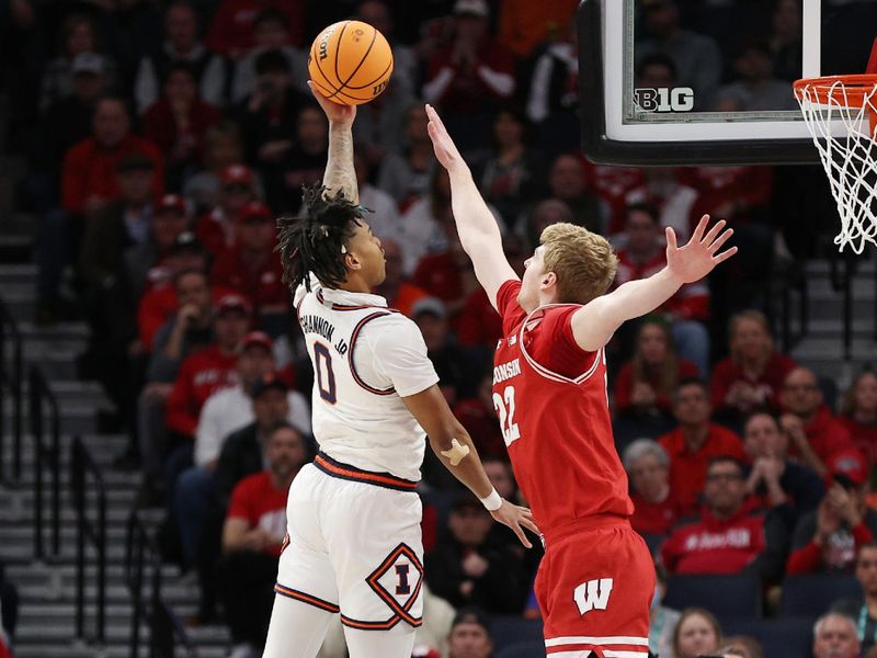 Mar 17, 2024; Minneapolis, MN, USA;  Illinois Fighting Illini guard Terrence Shannon Jr. (0) goes to the basket defender by Illinois Fighting Illini guard Keaton Kutcher (22) in the first half at Target Center. Mandatory Credit: Matt Krohn-USA TODAY Sports