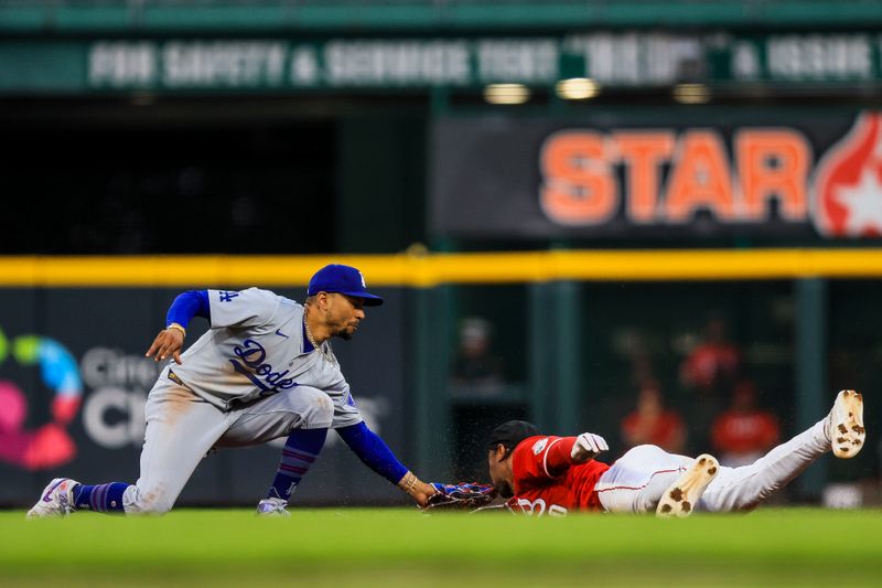 May 25, 2024; Cincinnati, Ohio, USA; Cincinnati Reds outfielder Will Benson (30) attempts to steal second against Los Angeles Dodgers shortstop Mookie Betts (50) in the fifth inning at Great American Ball Park. Mandatory Credit: Katie Stratman-USA TODAY Sports