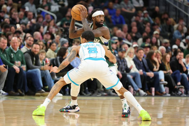 MILWAUKEE, WISCONSIN - FEBRUARY 09: Patrick Beverley #22 of the Milwaukee Bucks is defended by Nick Smith Jr. #8 of the Charlotte Hornets during a game at Fiserv Forum on February 09, 2024 in Milwaukee, Wisconsin. NOTE TO USER: User expressly acknowledges and agrees that, by downloading and or using this photograph, User is consenting to the terms and conditions of the Getty Images License Agreement. (Photo by Stacy Revere/Getty Images)