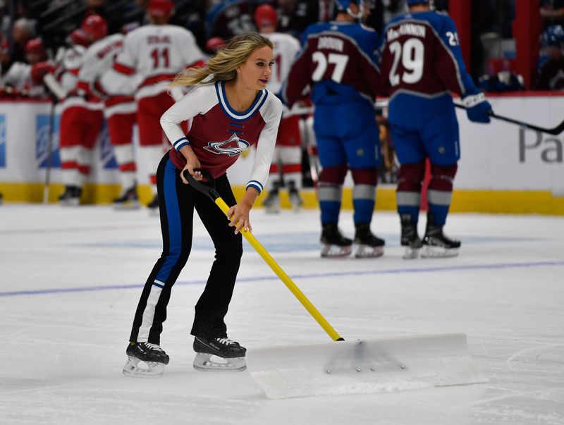 Oct 21, 2023; Denver, Colorado, USA; Colorado Avalanche Ice Patrol clear the ice during a break in the action during the Colorado Avalanche and Carolina Hurricanes game at Ball Arena. Mandatory Credit: John Leyba-USA TODAY Sports