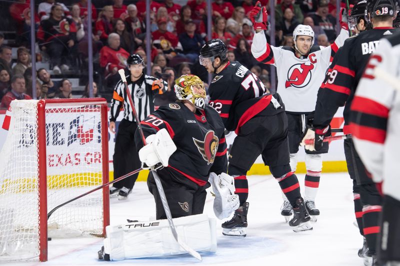 Apr 6, 2024; Ottawa, Ontario, CAN; New Jersey Devils center Nico Hischier (13) celebrates his goal scored against Ottawa Senators goalie Joonas Korpisalo (70) in the second period at the Canadian Tire Centre. Mandatory Credit: Marc DesRosiers-USA TODAY Sports