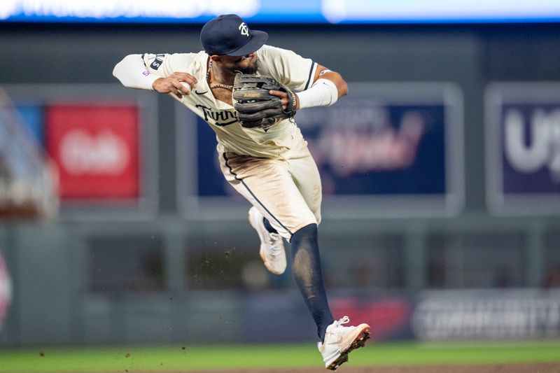 Sep 26, 2024; Minneapolis, Minnesota, USA; Minnesota Twins second base Willi Castro (50) fields the ball and throws out Miami Marlins second base Otto Lopez (61) in the sixth inning at Target Field. Mandatory Credit: Matt Blewett-Imagn Images