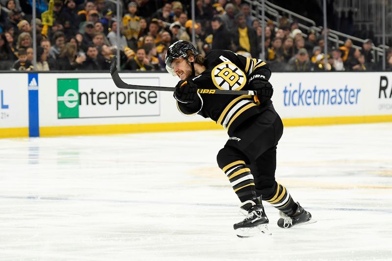 Mar 11, 2024; Boston, Massachusetts, USA;  Boston Bruins right wing David Pastrnak (88) scores a goal on a slap shot during the third period against the St. Louis Blues at TD Garden. Mandatory Credit: Bob DeChiara-USA TODAY Sports