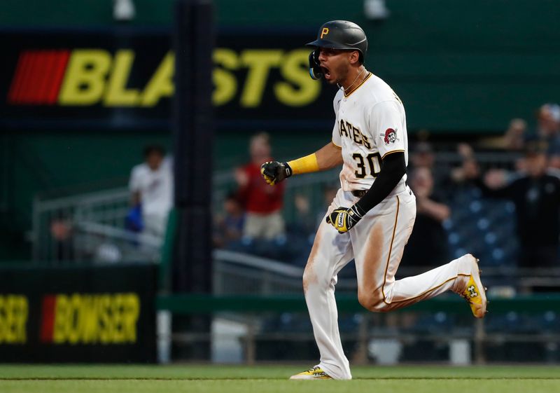 May 22, 2023; Pittsburgh, Pennsylvania, USA;  Pittsburgh Pirates shortstop Tucupita Marcano (30) reacts as he circles the bases on a grand slam home run against the Texas Rangers during the seventh inning at PNC Park. Mandatory Credit: Charles LeClaire-USA TODAY Sports