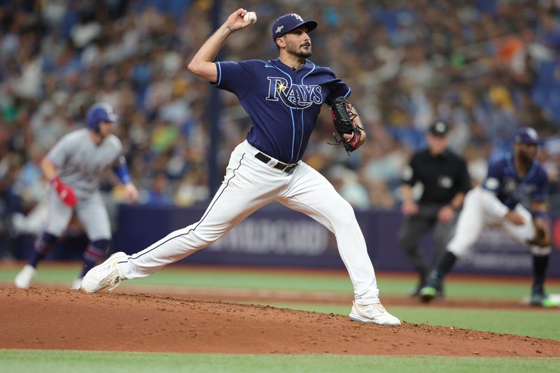 Oct 4, 2023; St. Petersburg, Florida, USA; Tampa Bay Rays starting pitcher Zach Eflin (24) pitches against the Texas Rangers in the fifth inning during game two of the Wildcard series for the 2023 MLB playoffs at Tropicana Field. Mandatory Credit: Nathan Ray Seebeck-USA TODAY Sports