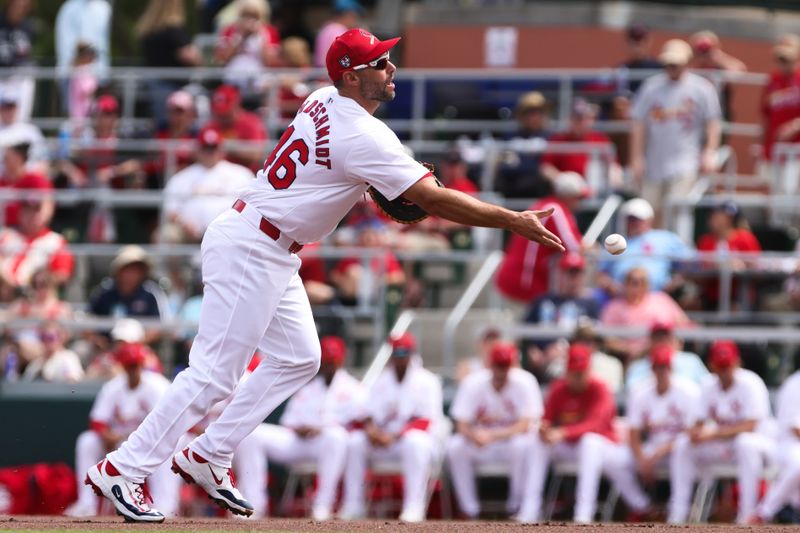 Mar 5, 2024; Jupiter, Florida, USA; St. Louis Cardinals first baseman Paul Goldschmidt (46) tosses the ball to first base  to retire Minnesota Twins catcher Christian Vazquez (not pictured) during the first inning at Roger Dean Chevrolet Stadium. Mandatory Credit: Sam Navarro-USA TODAY Sports