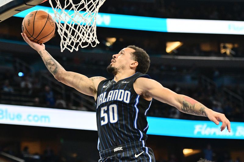 ORLANDO, FLORIDA - MARCH 19: Cole Anthony #50 of the Orlando Magic shoots the ball in the first half of a game against the Charlotte Hornets at Kia Center on March 19, 2024 in Orlando, Florida. NOTE TO USER: User expressly acknowledges and agrees that, by downloading and or using this photograph, User is consenting to the terms and conditions of the Getty Images License Agreement. (Photo by Julio Aguilar/Getty Images)