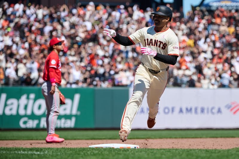 May 12, 2024; San Francisco, California, USA; San Francisco Giants infielder LaMonte Wade Jr. (31) gestures toward the Giants dugout after hitting a two run home run against the Cincinnati Reds during the fifth inning at Oracle Park. Mandatory Credit: Robert Edwards-USA TODAY Sports