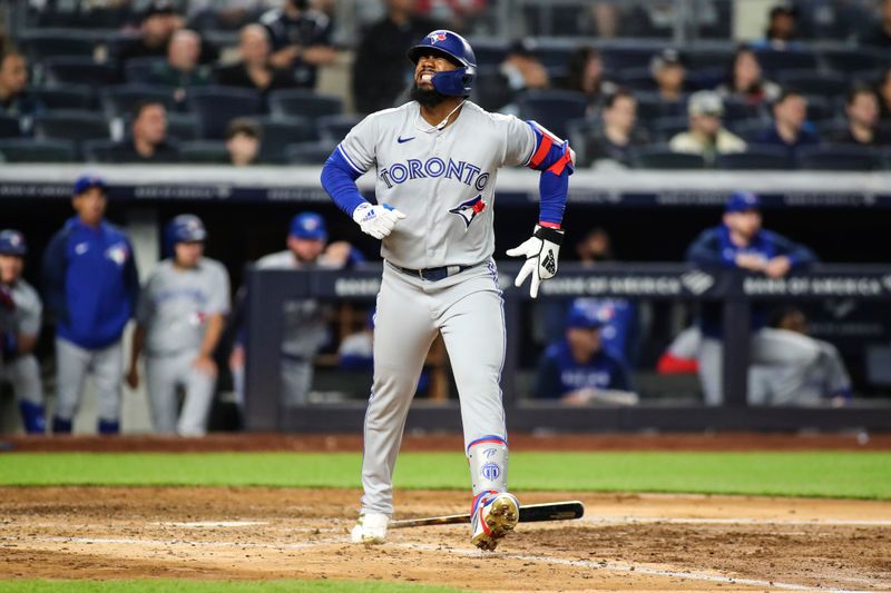 Apr 13, 2022; Bronx, New York, USA;  Toronto Blue Jays right fielder Teoscar Hernandez (37) reacts after injuring himself on a swing in the sixth inning against the New York Yankees at Yankee Stadium. Mandatory Credit: Wendell Cruz-USA TODAY Sports