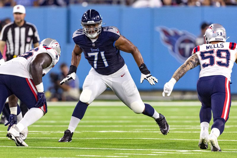 Tennessee Titans offensive tackle Andre Dillard (71) blocks during their NFL football game against the New England Patriots Friday, Aug. 25, 2023, in Nashville, Tenn. (AP Photo/Wade Payne)