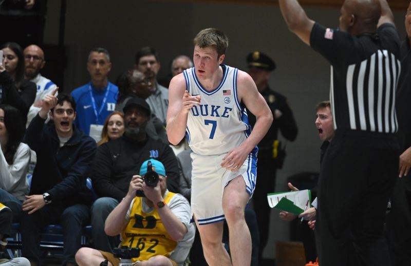 Jan 14, 2025; Durham, North Carolina, USA; dDuke Blue Devils forward Kon Knueppel (7) reacts after hitting a three-pointer during the first half against the Miami Hurricanes at Cameron Indoor Stadium. Mandatory Credit: Rob Kinnan-Imagn Images