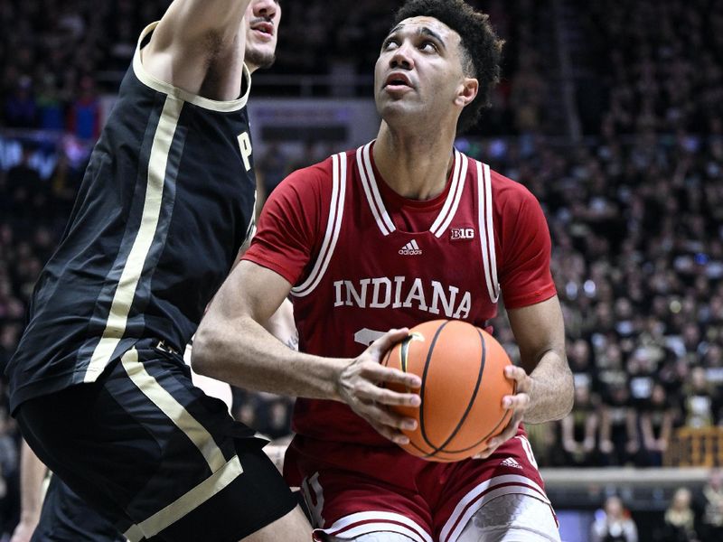 Feb 25, 2023; West Lafayette, Indiana, USA;  Indiana Hoosiers forward Trayce Jackson-Davis (23) controls the ball against Purdue Boilermakers center Zach Edey (15) during the first half at Mackey Arena. Mandatory Credit: Marc Lebryk-USA TODAY Sports