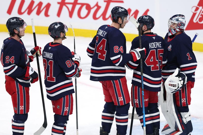 Oct 24, 2025; Winnipeg, Manitoba, CAN; Winnipeg Jets celebrate their victory against the Calgary Flames at Canada Life Centre. Mandatory Credit: James Carey Lauder-Imagn Images