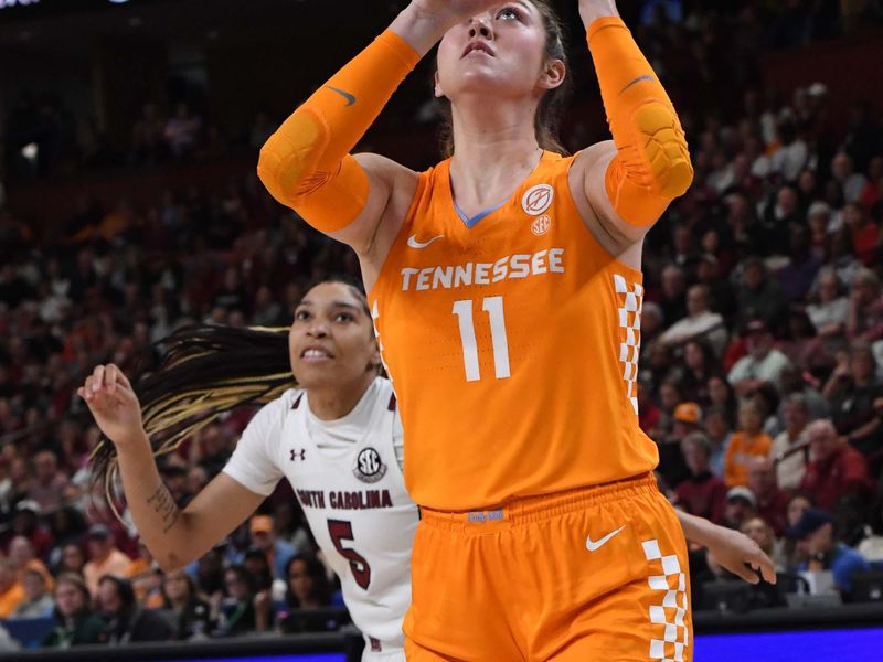 Mar 5, 2023; Greenville, SC, USA; Tennessee forward Caroline Striplin (11) shoots past South Carolina forward Victaria Saxton (5) during the first quarter of the SEC Women's Basketball Tournament at Bon Secours Wellness Arena. Mandatory Credit: Ken Ruinard-USA TODAY Sports