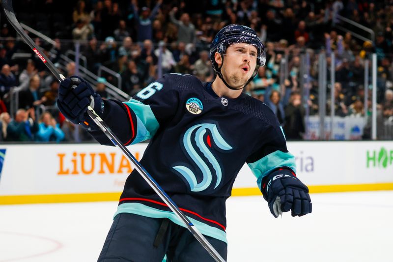 Feb 26, 2024; Seattle, Washington, USA; Seattle Kraken right wing Kailer Yamamoto (56) celebrates after scoring a goal against the Boston Bruins during an overtime shootout at Climate Pledge Arena. Mandatory Credit: Joe Nicholson-USA TODAY Sports