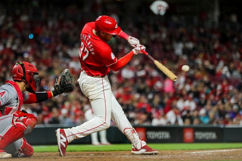 Apr 20, 2024; Cincinnati, Ohio, USA; Cincinnati Reds catcher Tyler Stephenson (37) hits a single against the Los Angeles Angels in the seventh inning at Great American Ball Park. Mandatory Credit: Katie Stratman-USA TODAY Sports