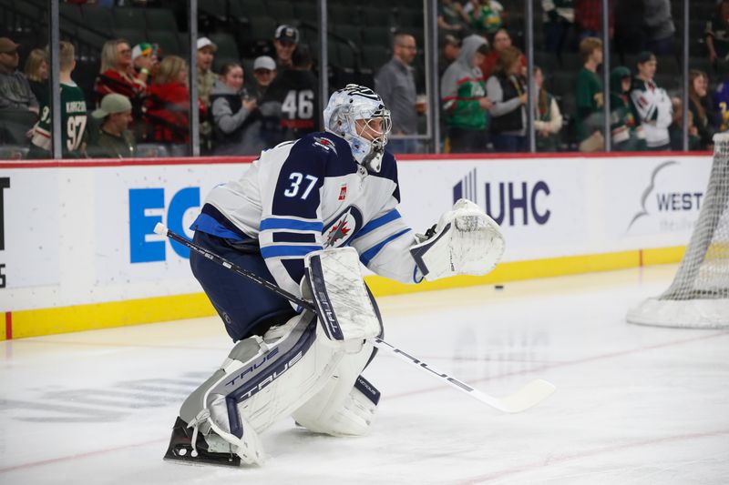 Apr 6, 2024; Saint Paul, Minnesota, USA;  Winnipeg Jets goaltender Connor Hellebuyck (37) warms up before a game against the Minnesota Wild at Xcel Energy Center. Mandatory Credit: Bruce Fedyck-USA TODAY Sports