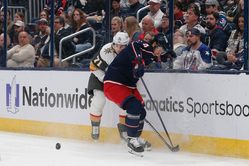 Mar 4, 2024; Columbus, Ohio, USA; Columbus Blue Jackets Forward Cole Sillinger (4) checks Vegas Golden Knights center William Karlsson (71) during the first period at Nationwide Arena. Mandatory Credit: Russell LaBounty-USA TODAY Sports