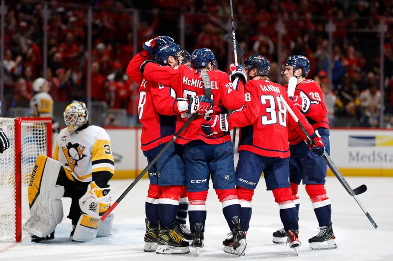 Apr 4, 2024; Washington, District of Columbia, USA; Washington Capitals left wing Alex Ovechkin (8) celebrates with teammates after scoring a goal on Pittsburgh Penguins goaltender Alex Nedeljkovic (39) in the third period at Capital One Arena. Mandatory Credit: Geoff Burke-USA TODAY Sports