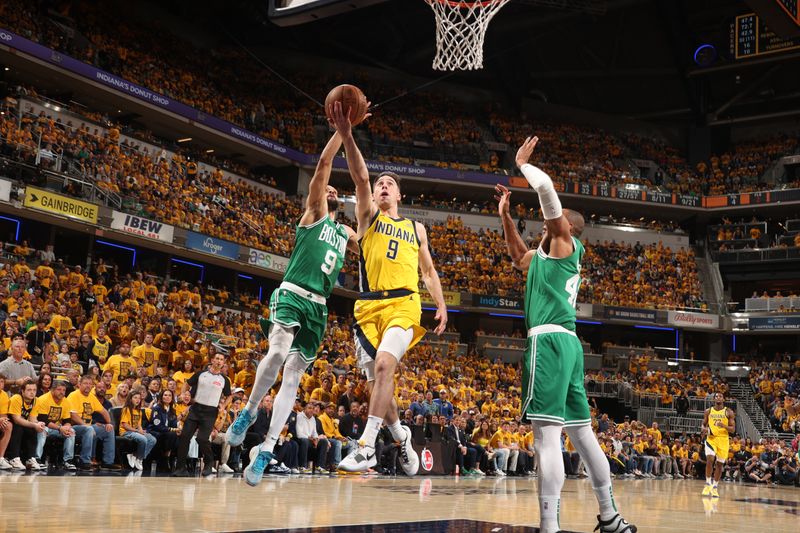 INDIANAPOLIS, IN - MAY 27: T.J. McConnell #9 of the Indiana Pacers drives to the basket during the game against the Boston Celtics during Game 4 of the Eastern Conference Finals of the 2024 NBA Playoffs on May 27, 2024 at Gainbridge Fieldhouse in Indianapolis, Indiana. NOTE TO USER: User expressly acknowledges and agrees that, by downloading and or using this Photograph, user is consenting to the terms and conditions of the Getty Images License Agreement. Mandatory Copyright Notice: Copyright 2024 NBAE (Photo by Nathaniel S. Butler/NBAE via Getty Images)