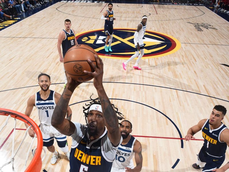 DENVER, CO - APRIL 10: Kentavious Caldwell-Pope #5 of the Denver Nuggets drives to the basket during the game against the Minnesota Timberwolves on April 10, 2024 at the Ball Arena in Denver, Colorado. NOTE TO USER: User expressly acknowledges and agrees that, by downloading and/or using this Photograph, user is consenting to the terms and conditions of the Getty Images License Agreement. Mandatory Copyright Notice: Copyright 2024 NBAE (Photo by Garrett Ellwood/NBAE via Getty Images)