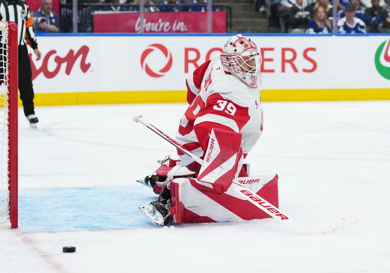 Oct 2, 2025; Toronto, Ontario, CAN; Detroit Red Wings goaltender Cam Talbot (39) steers a puck to the corner against the Toronto Maple Leafs during the third period at Scotiabank Arena. Mandatory Credit: Nick Turchiaro-Imagn Images