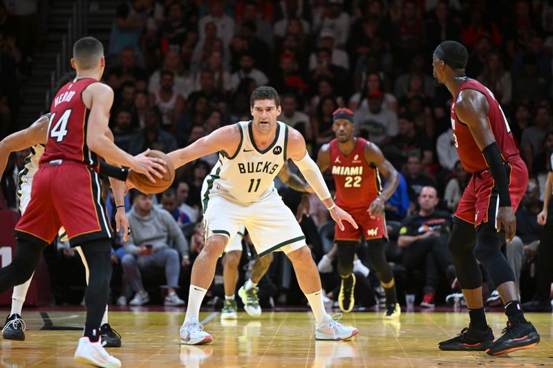 MIAMI, FL - NOVEMBER 26:  Brook Lopez #11 of the Milwaukee Bucks plays defense during an NBA Cup game against the Miami Heat on November 26, 2024 at Kaseya Center in Miami, Florida. NOTE TO USER: User expressly acknowledges and agrees that, by downloading and or using this Photograph, user is consenting to the terms and conditions of the Getty Images License Agreement. Mandatory Copyright Notice: Copyright 2024 NBAE (Photo by Chris Tilley/NBAE via Getty Images)