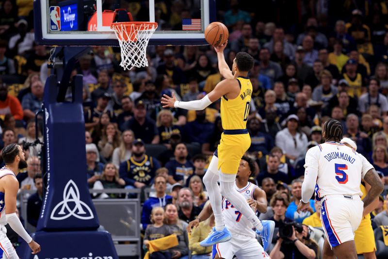 INDIANAPOLIS, INDIANA - OCTOBER 27: Tyrese Haliburton #0 of the Indiana Pacers takes a shot over Kyle Lowry #7 of the Philadelphia 76ers during the first half at Gainbridge Fieldhouse on October 27, 2024 in Indianapolis, Indiana. NOTE TO USER: User expressly acknowledges and agrees that, by downloading and or using this photograph, User is consenting to the terms and conditions of the Getty Images License Agreement. (Photo by Justin Casterline/Getty Images)