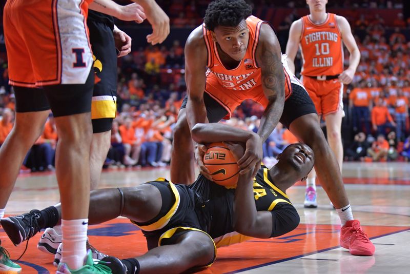 Feb 24, 2024; Champaign, Illinois, USA;  Illinois Fighting Illini forward Amani Hansberry (35) tries to pull the ball from Iowa Hawkeyes forward Ladji Dembele (13) during the first half at State Farm Center. Mandatory Credit: Ron Johnson-USA TODAY Sports