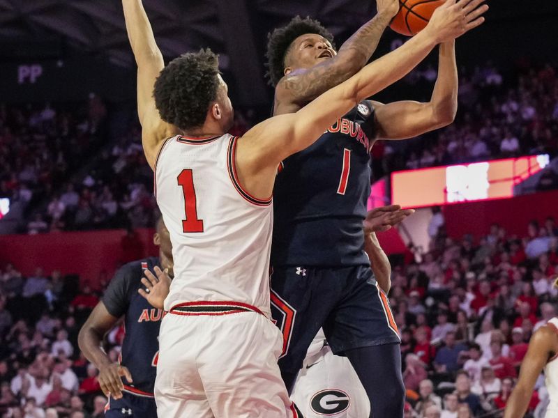 Jan 4, 2023; Athens, Georgia, USA; Auburn Tigers guard Wendell Green Jr. (1) tries to shoot against Georgia Bulldogs guard Jabri Abdur-Rahim (1) during the first half at Stegeman Coliseum. Mandatory Credit: Dale Zanine-USA TODAY Sports