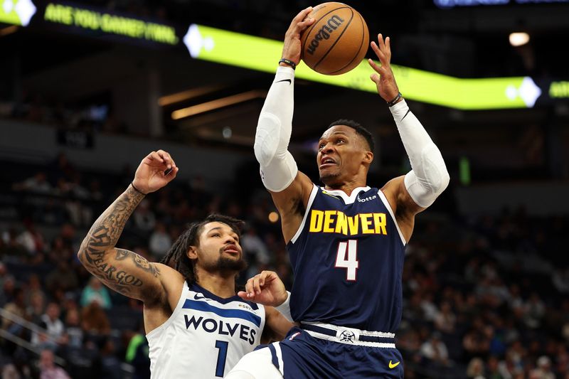 MINNEAPOLIS, MINNESOTA - OCTOBER 17: Russell Westbrook #4 of the Denver Nuggets goes up for a shot against Daishen Nix #1 of the Minnesota Timberwolves in the fourth quarter of a preseason game at Target Center on October 17, 2024 in Minneapolis, Minnesota. The Nuggets defeated the Timberwolves 132-126. NOTE TO USER: User expressly acknowledges and agrees that, by downloading and or using this photograph, User is consenting to the terms and conditions of the Getty Images License Agreement. (Photo by David Berding/Getty Images)