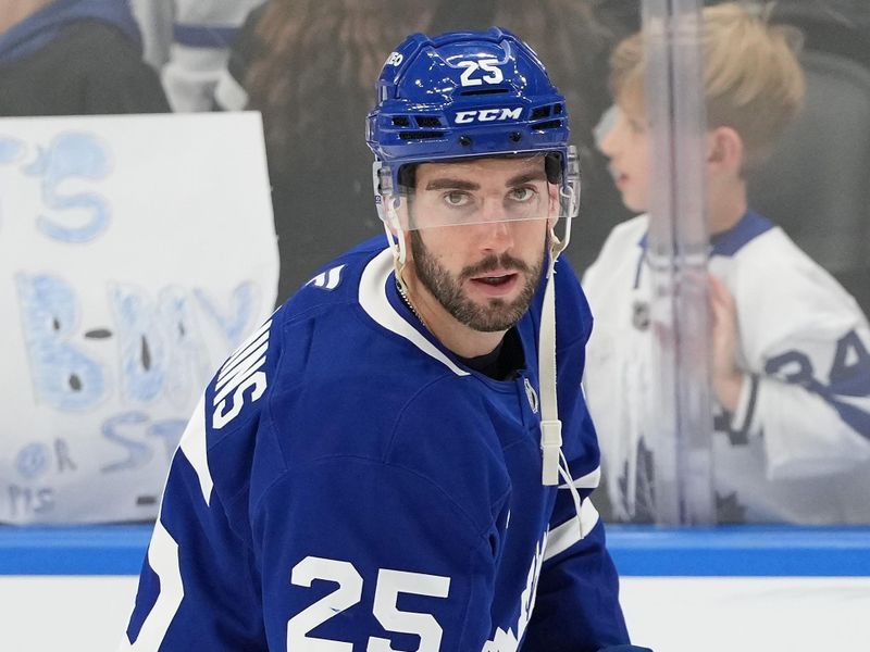 Dec 6, 2024; Toronto, Ontario, CAN; Toronto Maple Leafs defenseman Conor Timmins (25) skates during the warmup before a game against the Washington Capitals at Scotiabank Arena. Mandatory Credit: Nick Turchiaro-Imagn Images