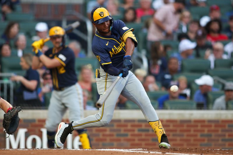 Aug 7, 2024; Atlanta, Georgia, USA; Milwaukee Brewers left fielder Jackson Chourio (11) hits a single against the Atlanta Braves in the second inning at Truist Park. Mandatory Credit: Brett Davis-USA TODAY Sports