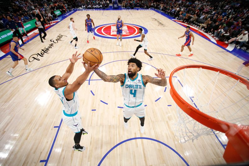 DETROIT, MI - March 11: Nick Richards #4 of the Charlotte Hornets rebounds the ball during the game against the Detroit Pistons on March 11, 2024 at Little Caesars Arena in Detroit, Michigan. NOTE TO USER: User expressly acknowledges and agrees that, by downloading and/or using this photograph, User is consenting to the terms and conditions of the Getty Images License Agreement. Mandatory Copyright Notice: Copyright 2024 NBAE (Photo by Brian Sevald/NBAE via Getty Images)