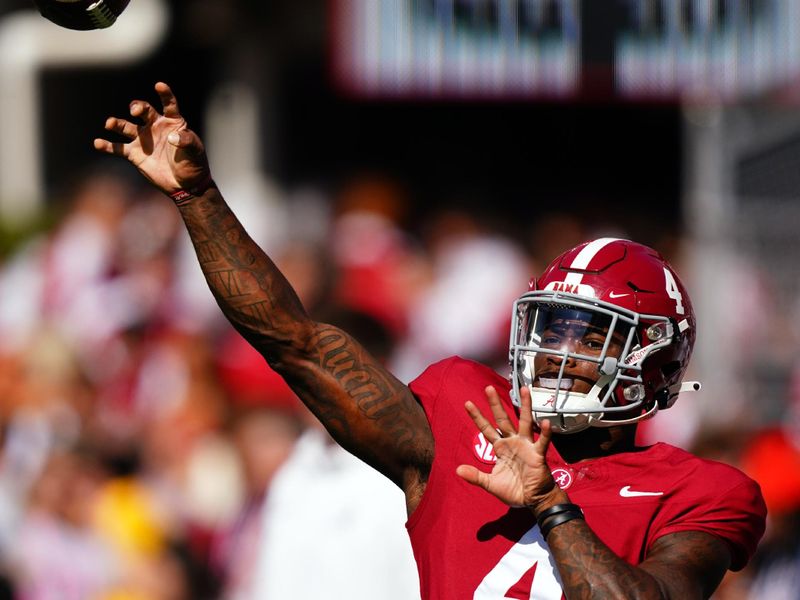 Oct 14, 2023; Tuscaloosa, Alabama, USA; Alabama Crimson Tide quarterback Jalen Milroe (4) passing during warmups prior to their game against the Arkansas Razorbacks at Bryant-Denny Stadium. Mandatory Credit: John David Mercer-USA TODAY Sports