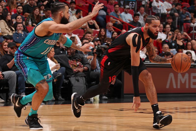 MIAMI, FL - JANUARY 14: Caleb Martin #16 of the Miami Heat handles the ball during the game against the Charlotte Hornets on January 14, 2024 at Kaseya Center in Miami, Florida. NOTE TO USER: User expressly acknowledges and agrees that, by downloading and or using this Photograph, user is consenting to the terms and conditions of the Getty Images License Agreement. Mandatory Copyright Notice: Copyright 2024 NBAE (Photo by Issac Baldizon/NBAE via Getty Images)