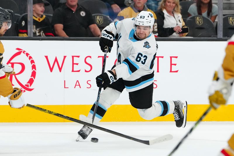 Sep 27, 2024; Las Vegas, Nevada, USA; Utah Hockey Club forward Matias Maccelli (63) shoots against the Vegas Golden Knights during the third period at T-Mobile Arena. Mandatory Credit: Stephen R. Sylvanie-Imagn Images